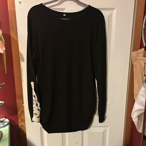 Black Long Sleeve sweater with ruching on sides and lace detail on wrists.